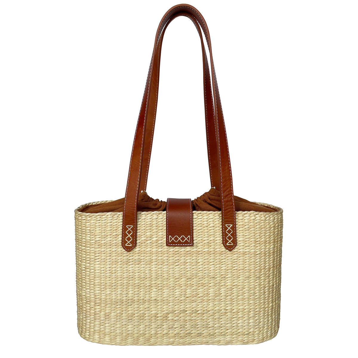 Front view of the square basket bag with terracotta linen lining and leather tab closure