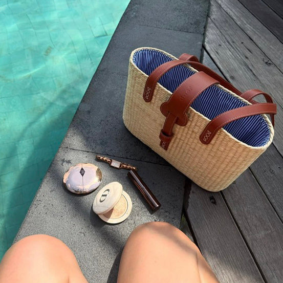 Street style shot of the square basket bag worn over the shoulder